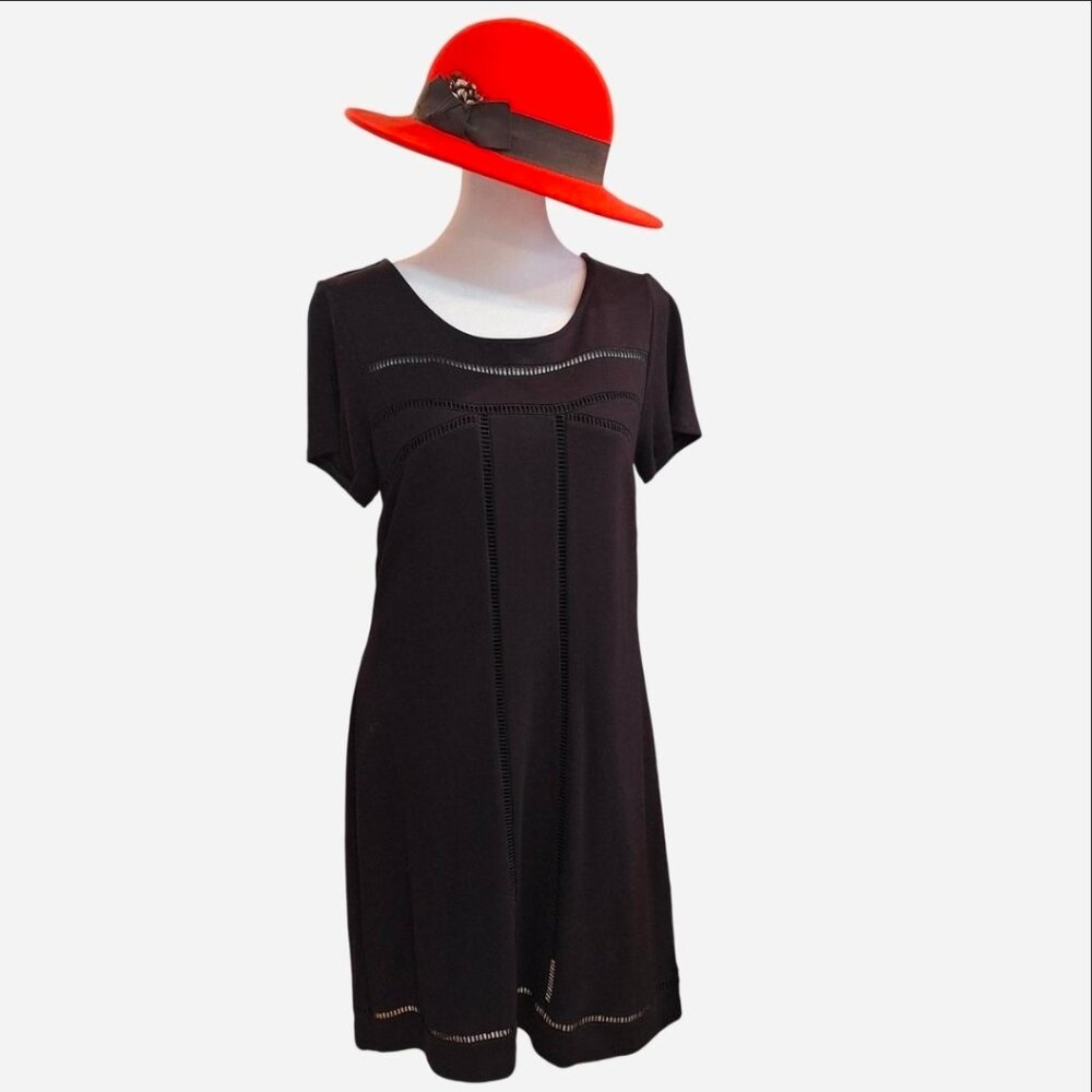 Women's black short sleeve midi dress by KAARI BLUE. Size small